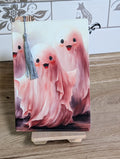 Cute ghost notebook front cover with three pink watercolor ghosts and silver tassel