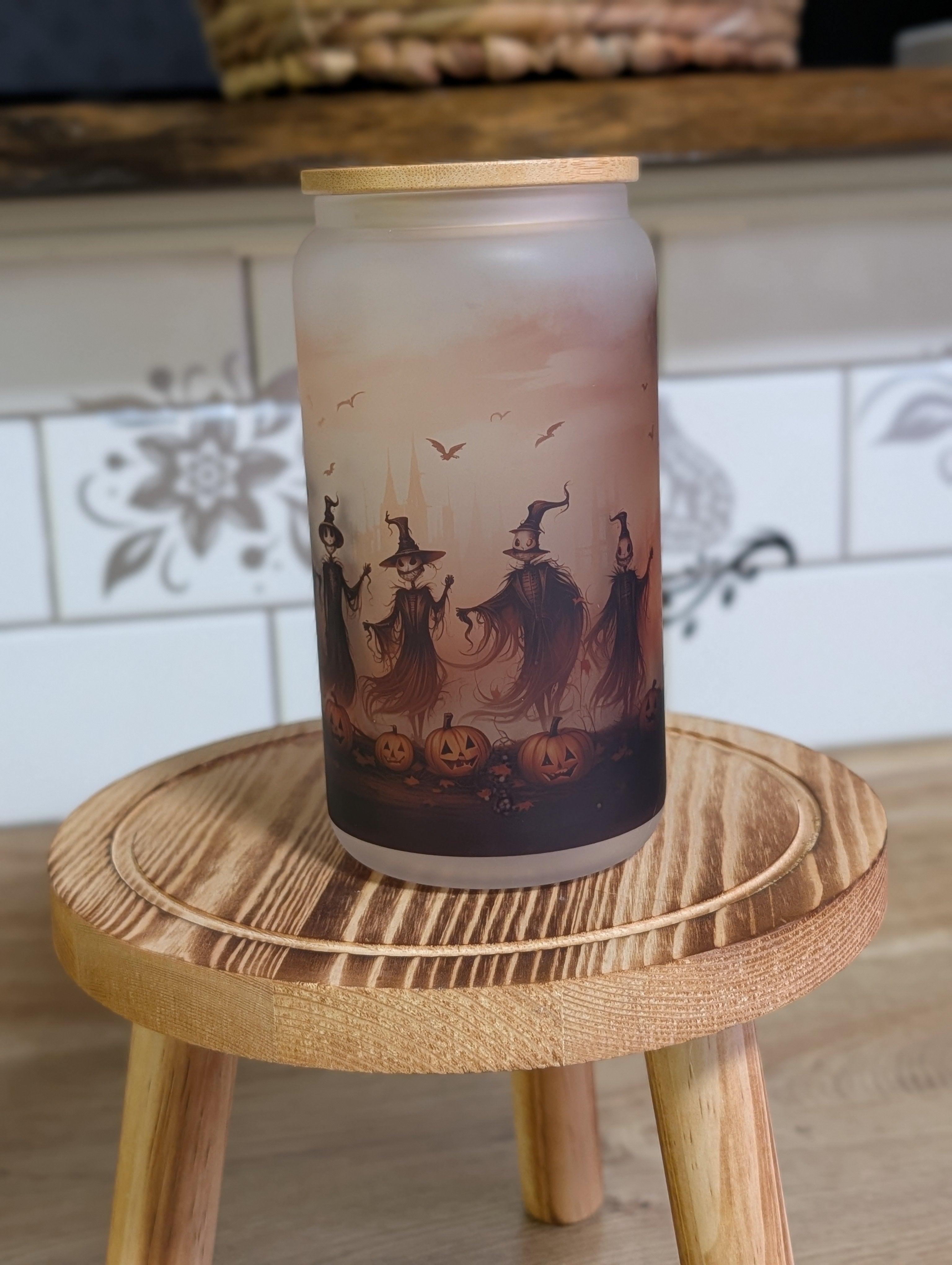 Halloween scarecrow witches frosted glass can angled view showing scarecrow witch figures in mist