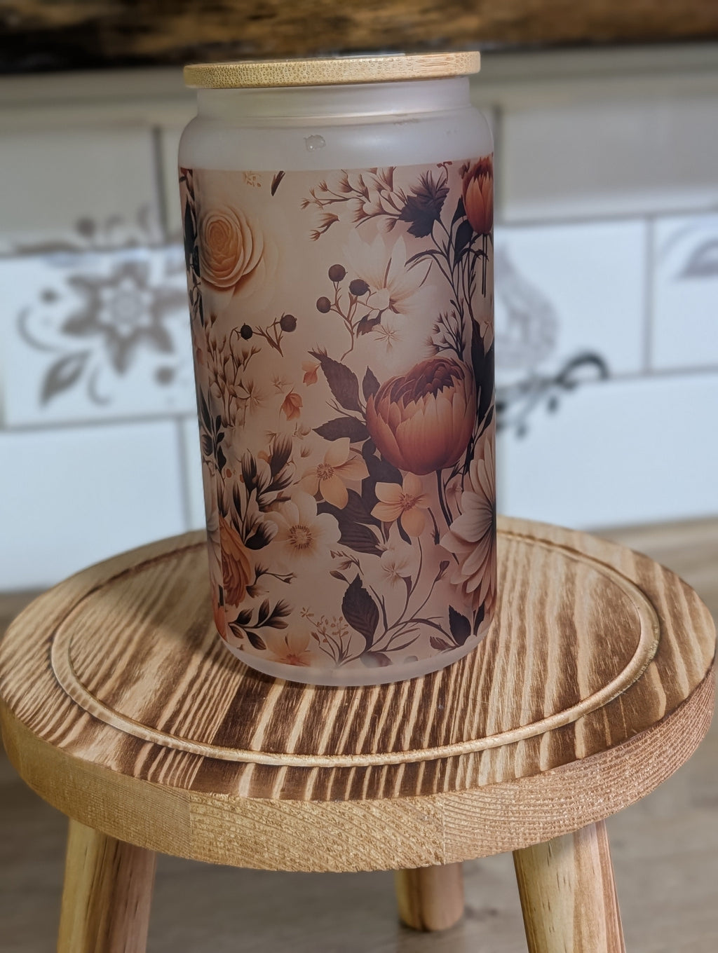 Vintage botanical floral frosted glass can front view with bamboo lid showing terracotta and cream flowers