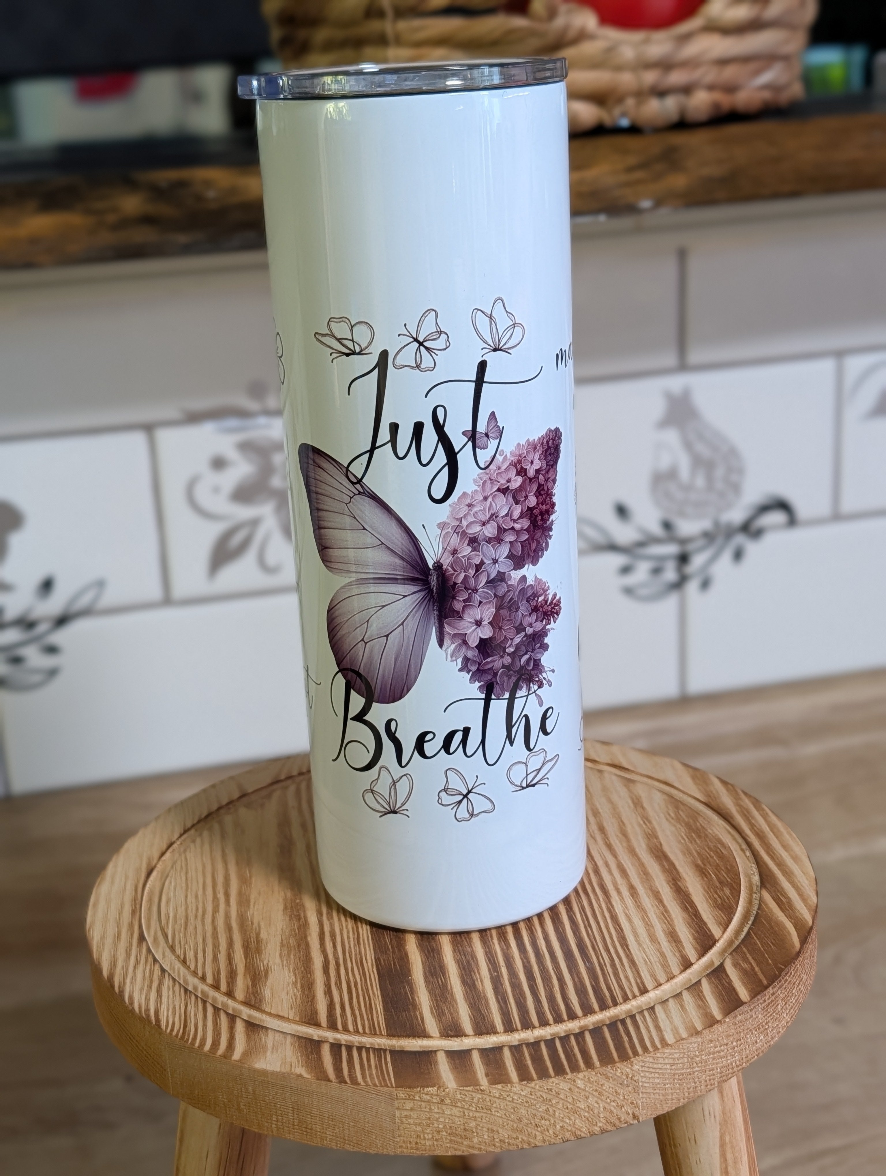 Just Breathe butterfly tumbler front view with lid on showing full butterfly and hydrangea design
