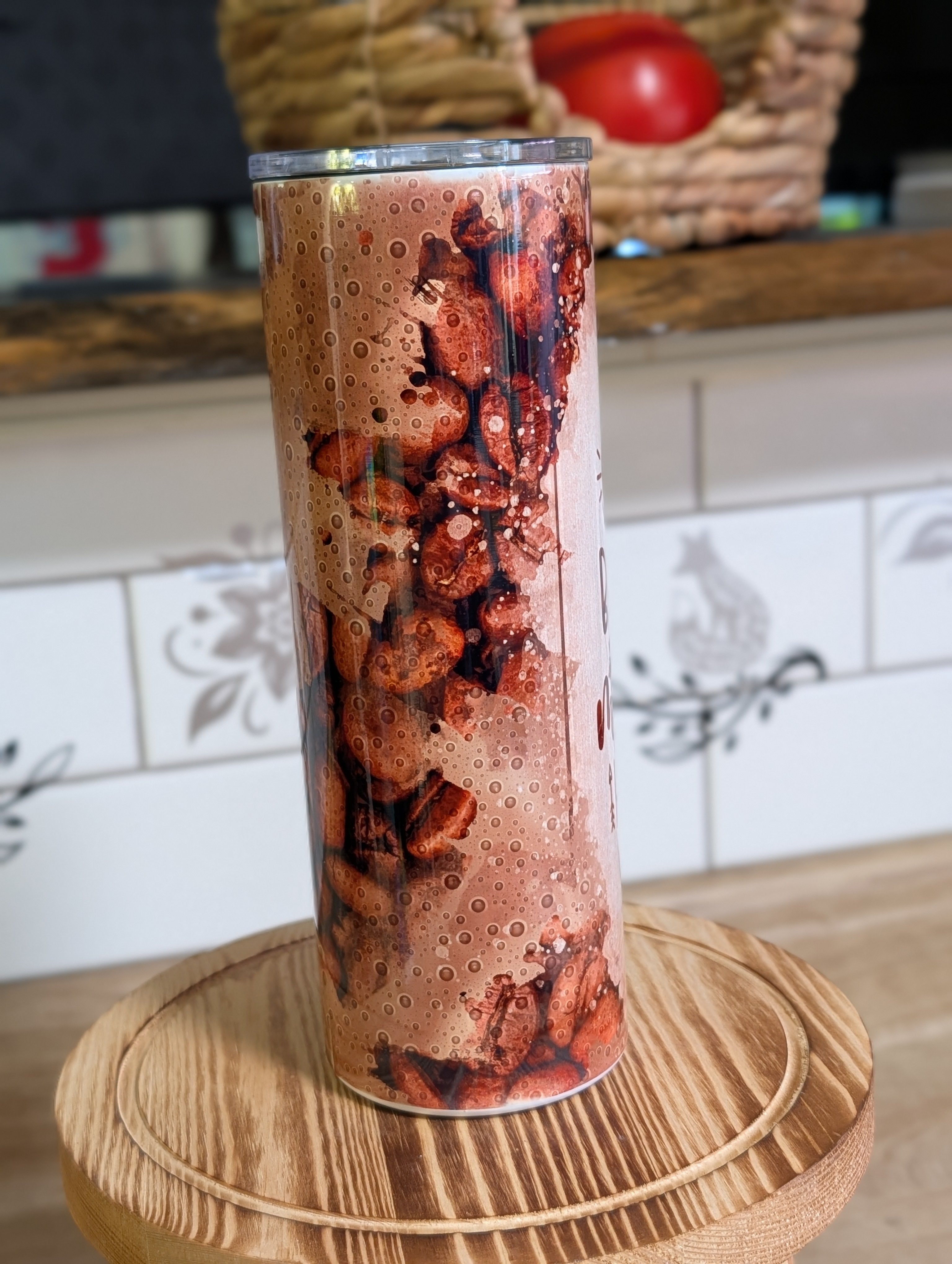 Coffee Because Monday Happens tumbler with lid off on wooden stool
