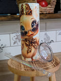 Glamour duck tumbler with lid and straw laid beside it