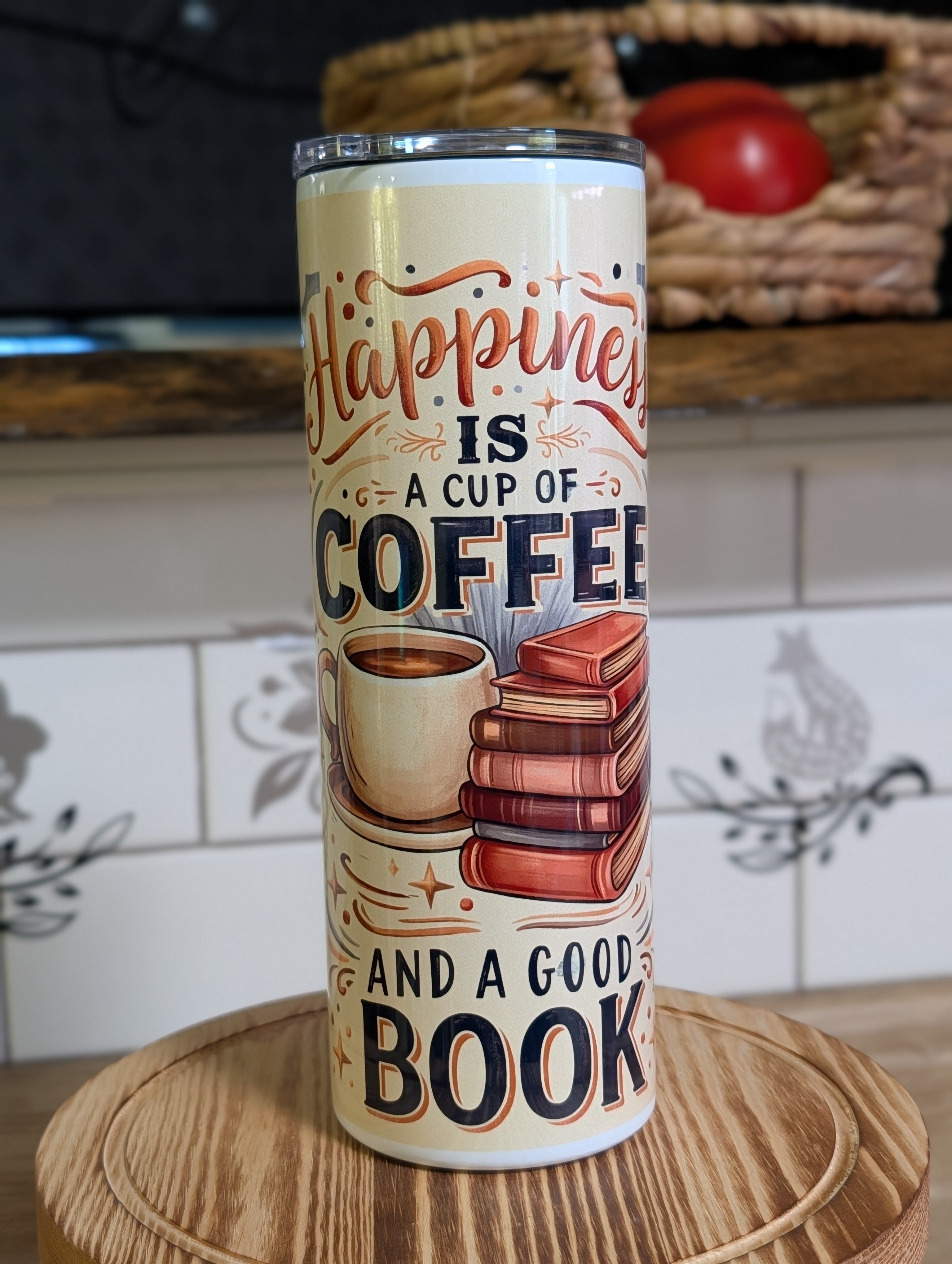Happiness Is a Cup of Coffee and a Good Book tumbler front view with lid on