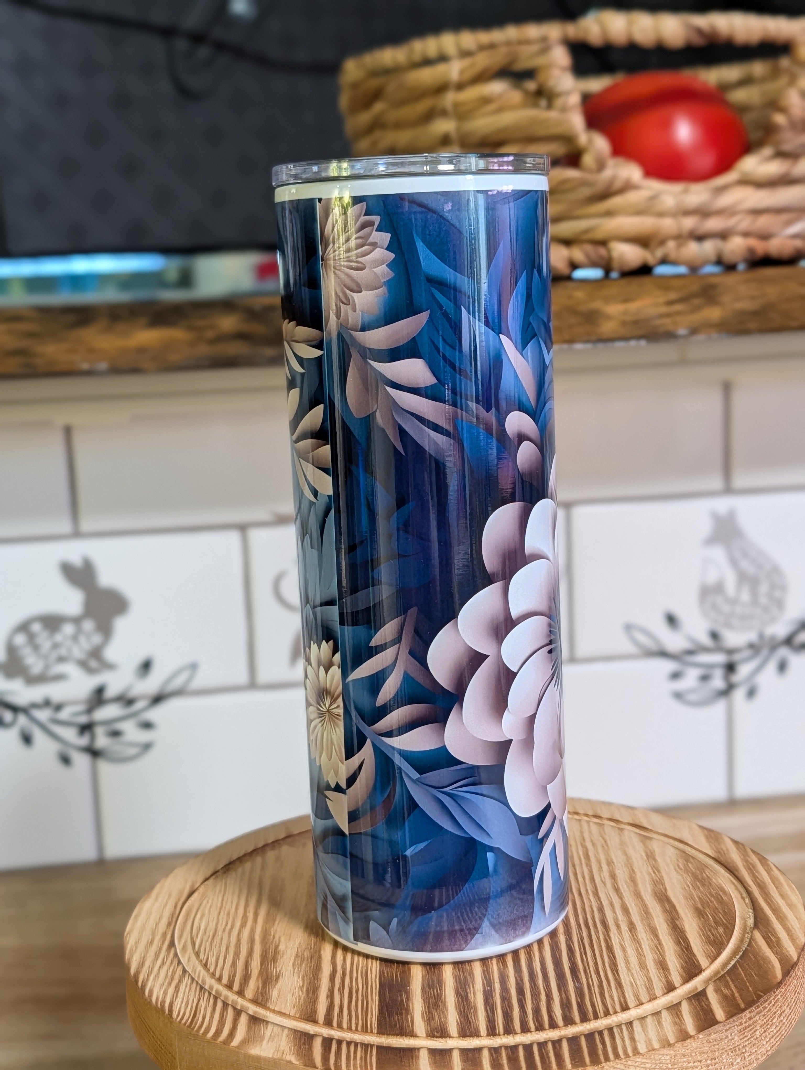 3D navy blue floral peony tumbler front view with lid off on wooden stool