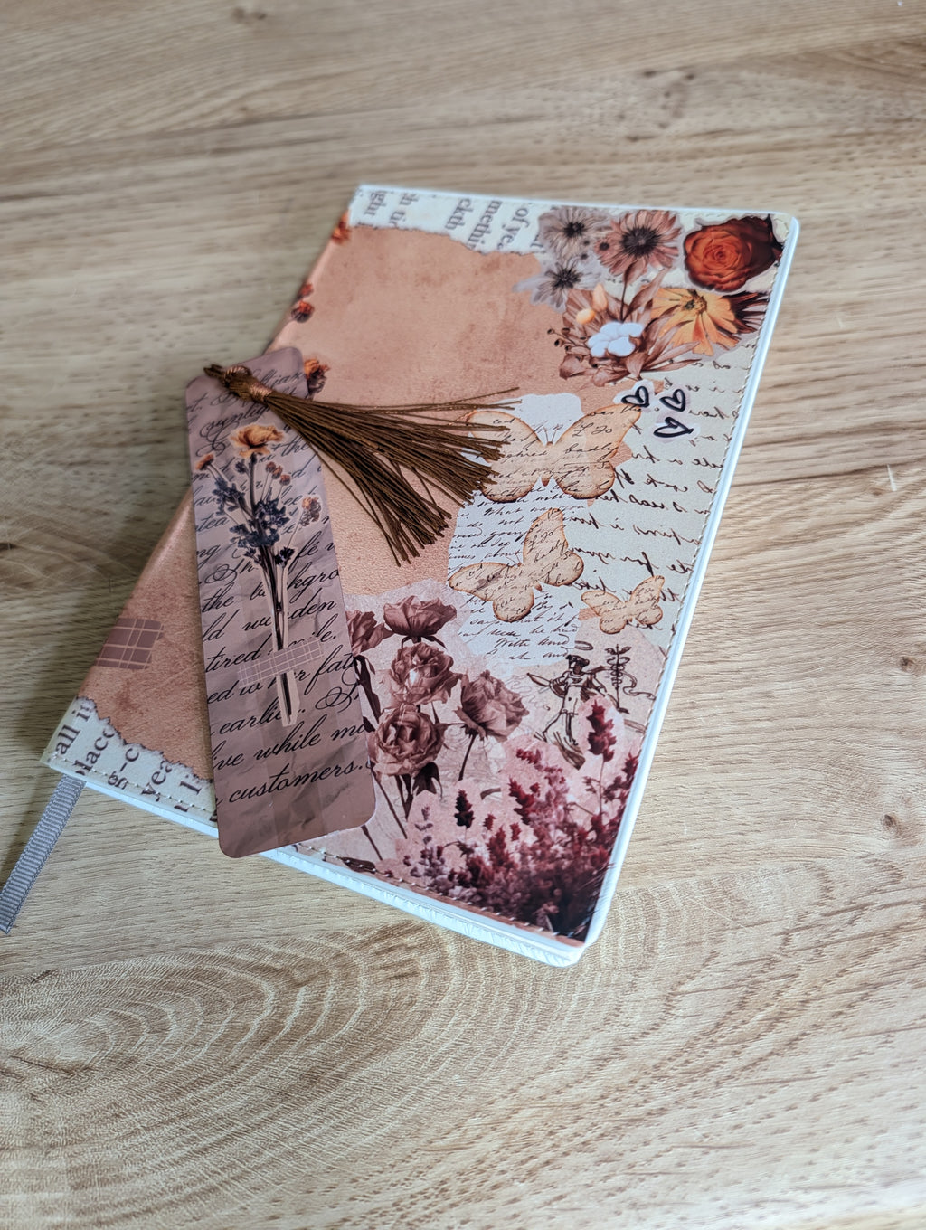 Scrapbook botanical bookmark resting on matching journal