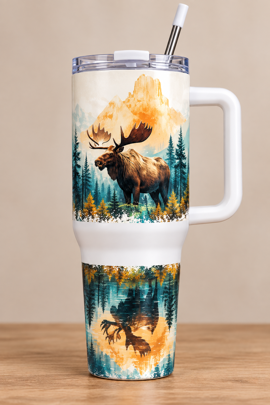 White 40oz tumbler with brown moose before golden peaks and teal forest