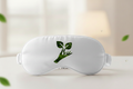 Satin white sleep mask with wellness logo