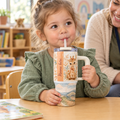 Toddler using the giraffe tumbler